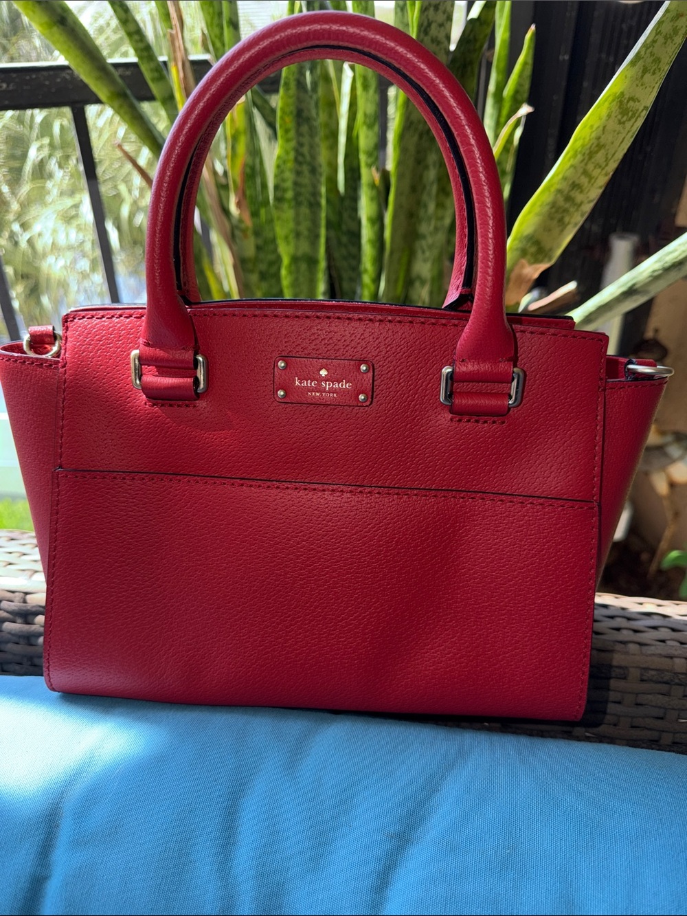 KATE SPADE red leather satchel with silver hardware.